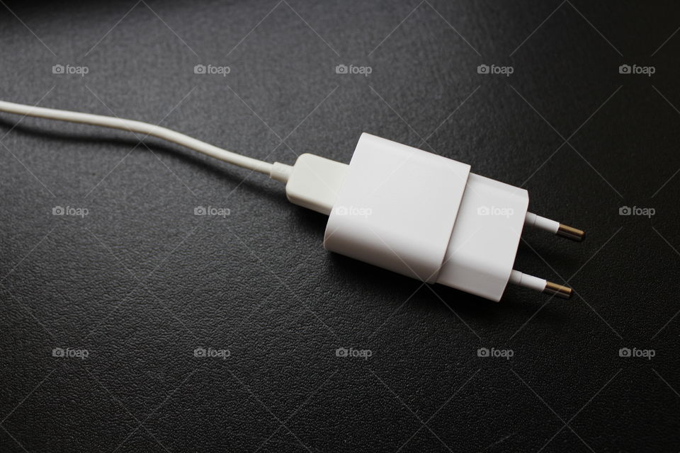 white USB charger and cable