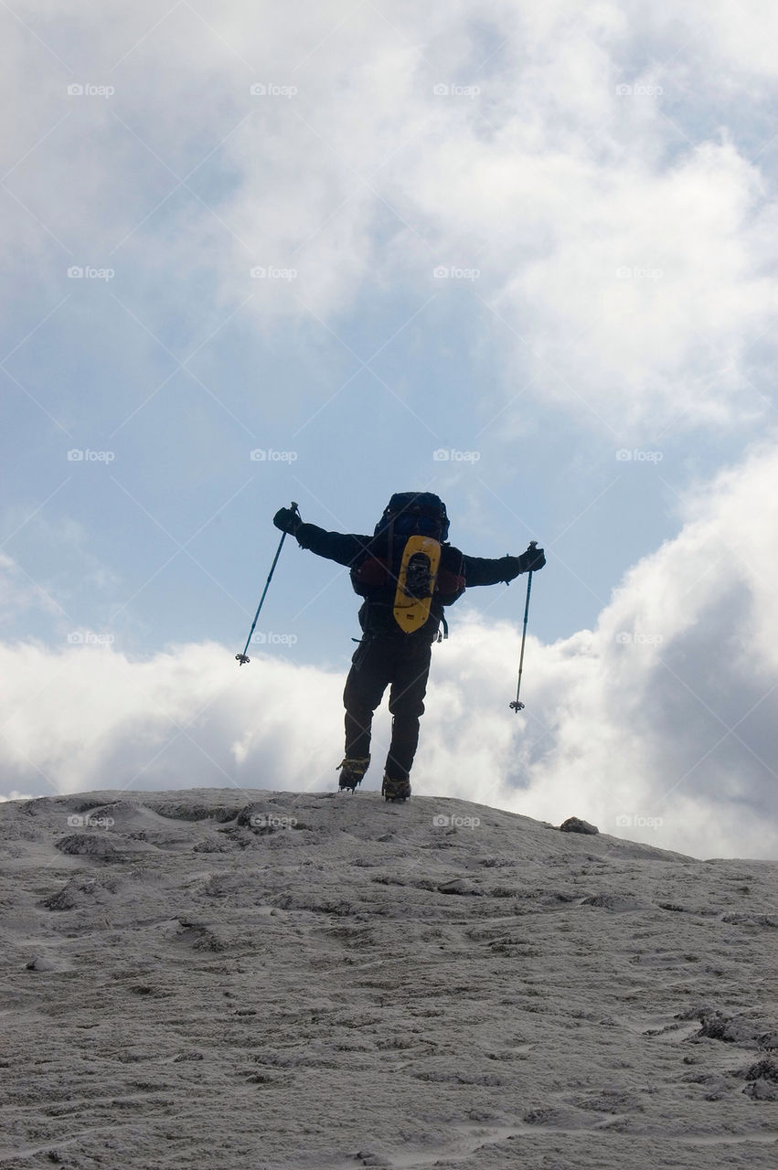 Backpackers celebrates achieving the summit of Mount Eisenhower the