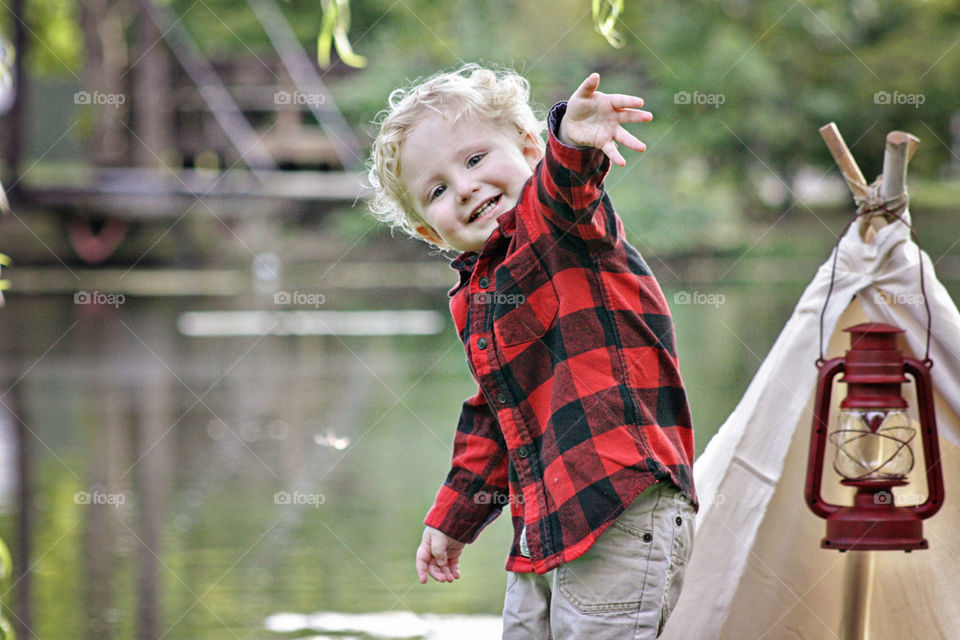 Red and black plaid shirt reflection of water