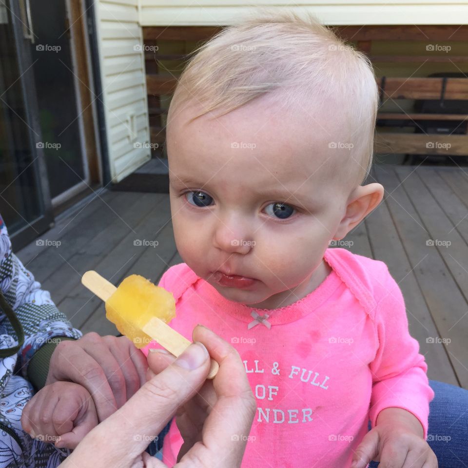 Sad baby girl. Teething baby needs a Popsicle

