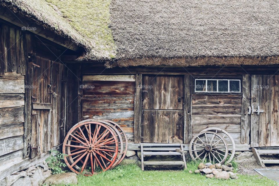 Old wooden house from the outside with historical background 