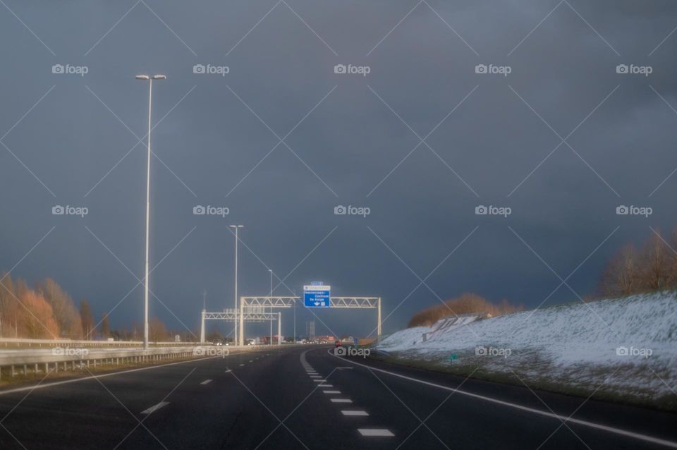 Highway in the north of The Netherlands, taken from the car in the afternoon. 
