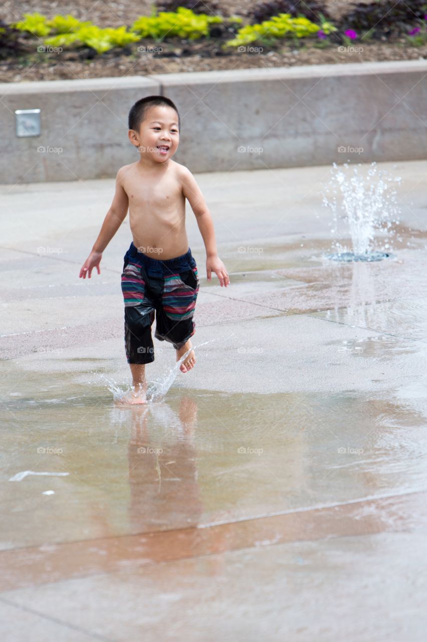 Boy playing water 