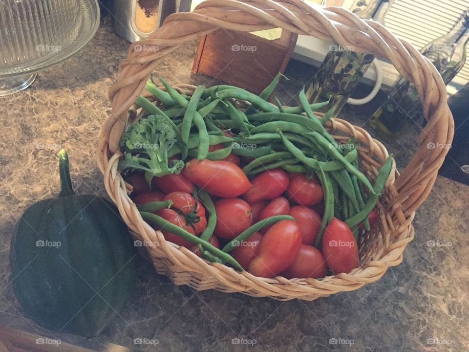 One full basket of fresh veggies from garden. 