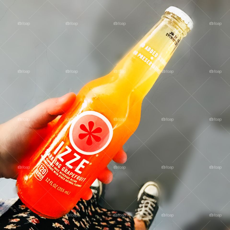 Me holding an Izze drink 