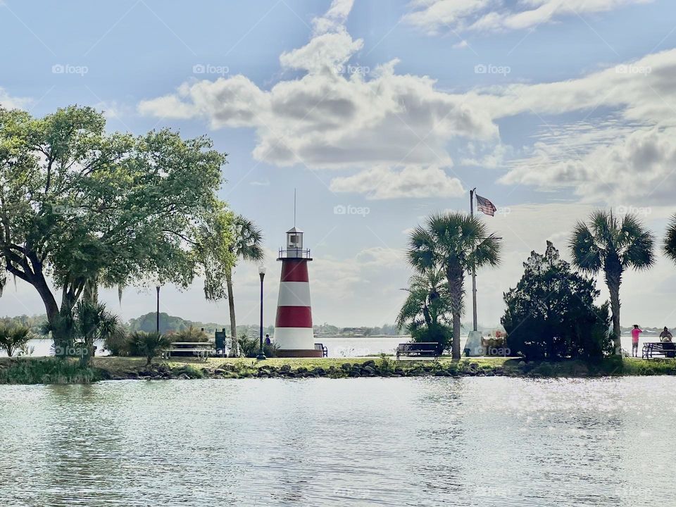 A light house on a small port on an island 