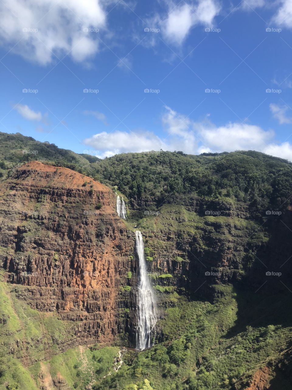 Waterfall View From Helicopter Tour In Kauai, Hawaii