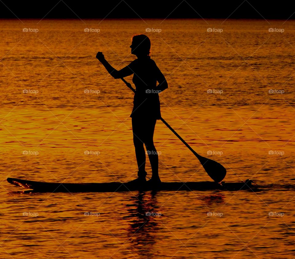 Paddle boarding in the sunset