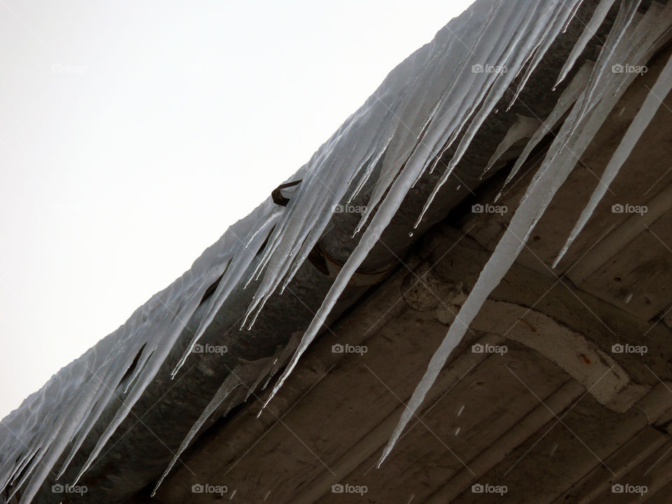Low angle view of icicles against sky in Jūrmala, Latvia.