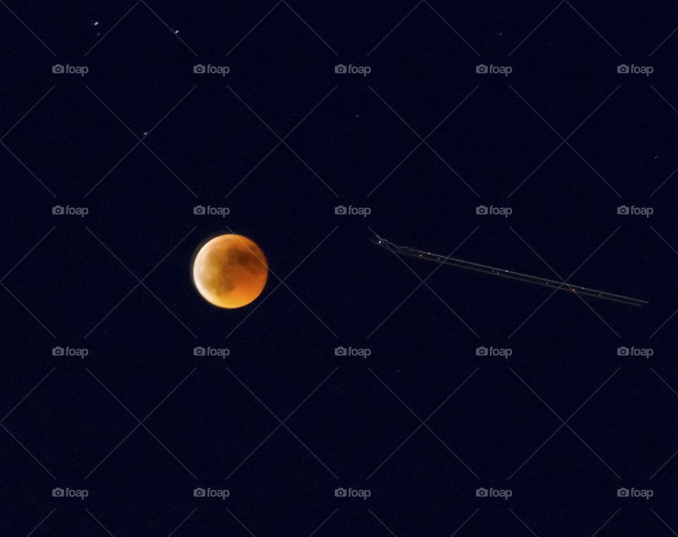 Moon eclipse and plane path