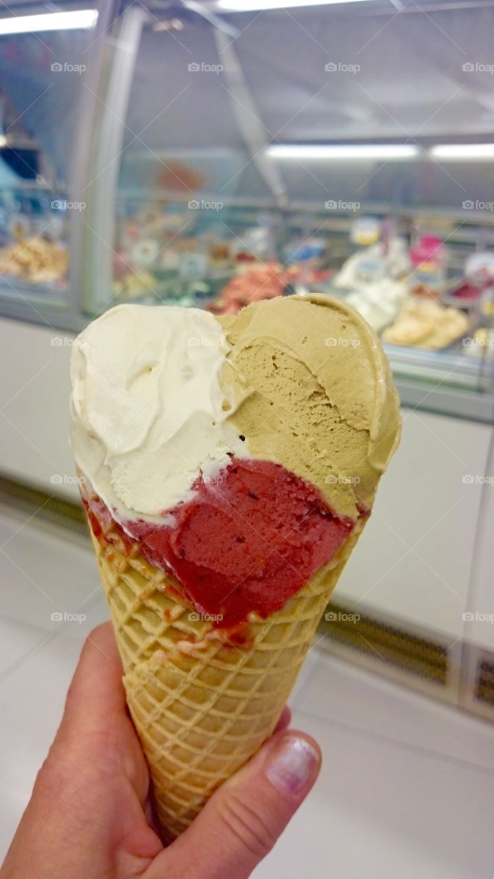 Woman hand holding ice cream cone