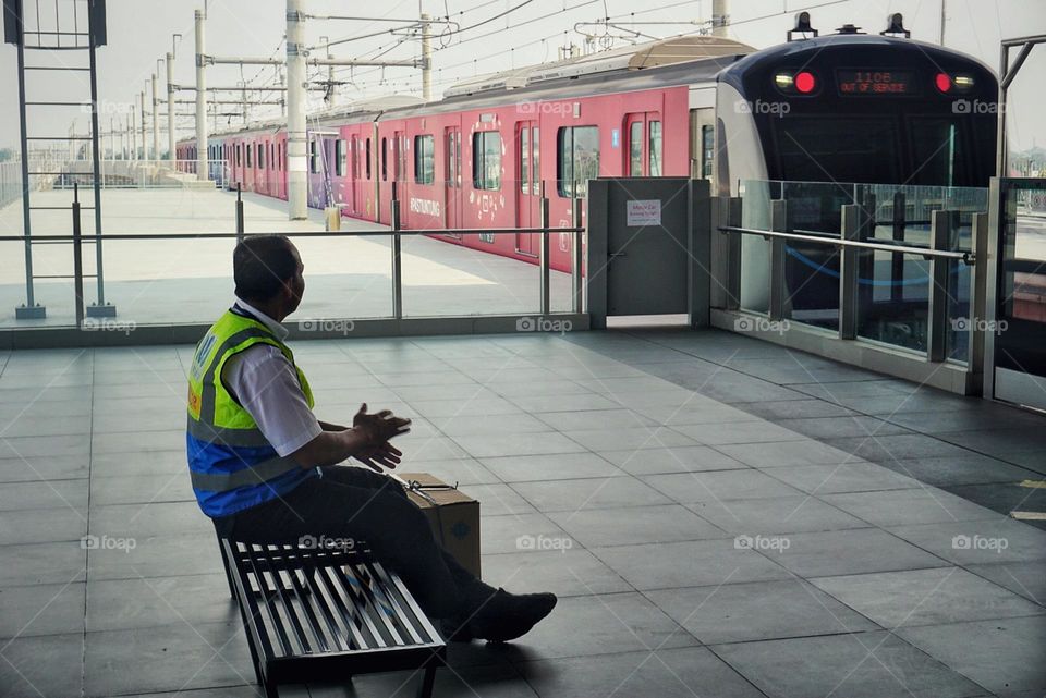 A passenger is waiting for the train to arrive.