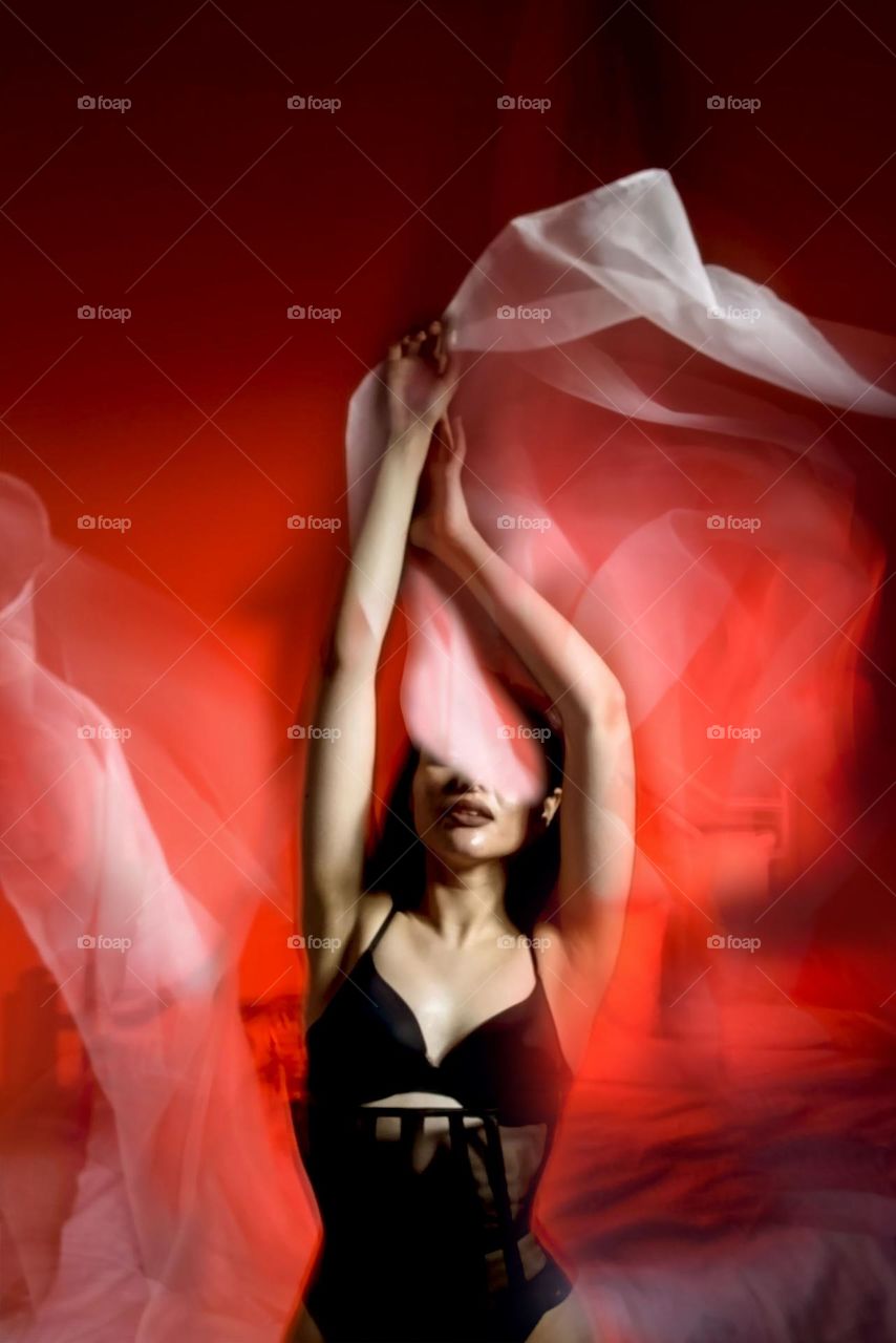 Beautiful girl in red light.