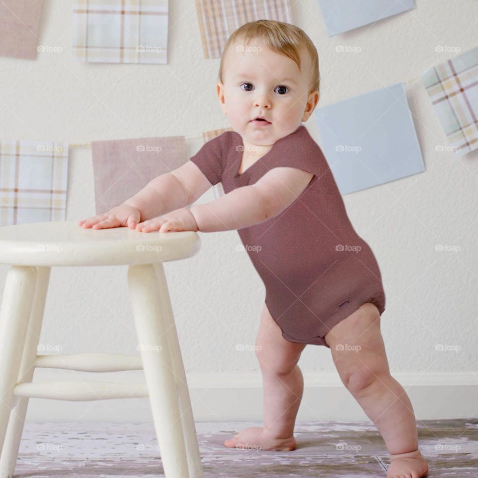 toddler in maroon romper