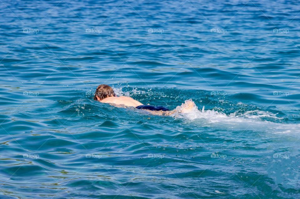 Man's swimming in the sea