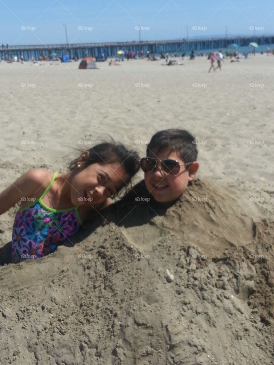 Just a couple of kids playing in the sand on a beautiful summer day!