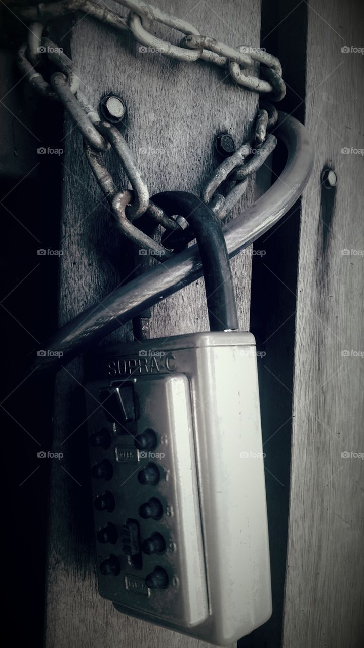 rusty chains and old lock. locked up