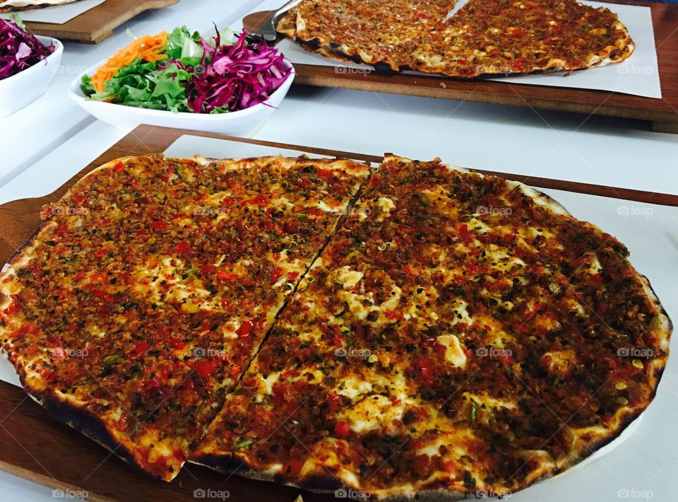 This colorful, wonderful looking "Turkish Pizza" as some call it... meet Lahmacun. It is so delicious topped with fresh parsley and spash of fresh squeezed lemon. One of main Turkish dishes, is a must have! 