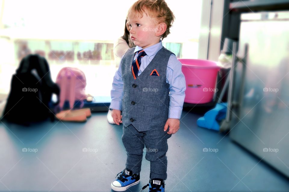 Close-up of a boy wearing suit