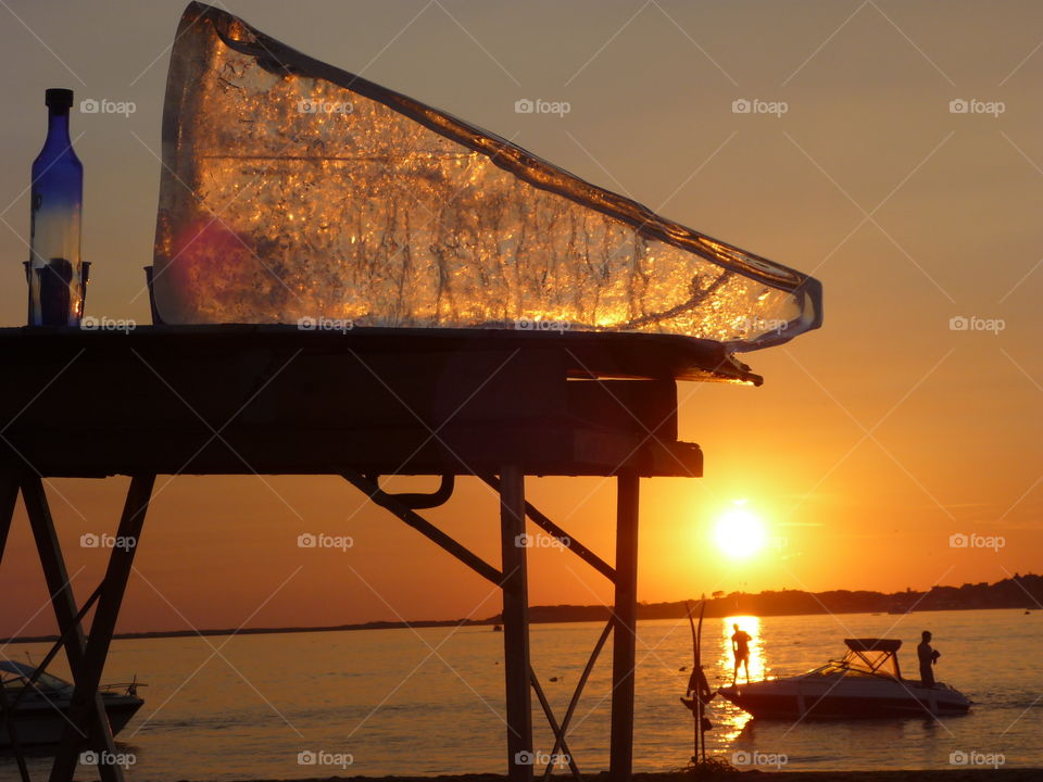 Drinking at sunset on the beach