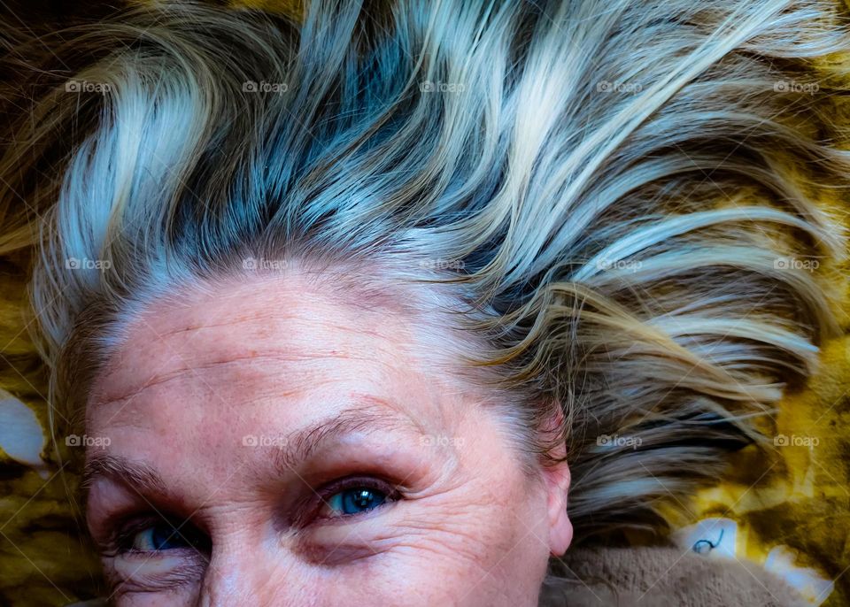 Blonde Scandinavian woman with flowing hair looking at camera
