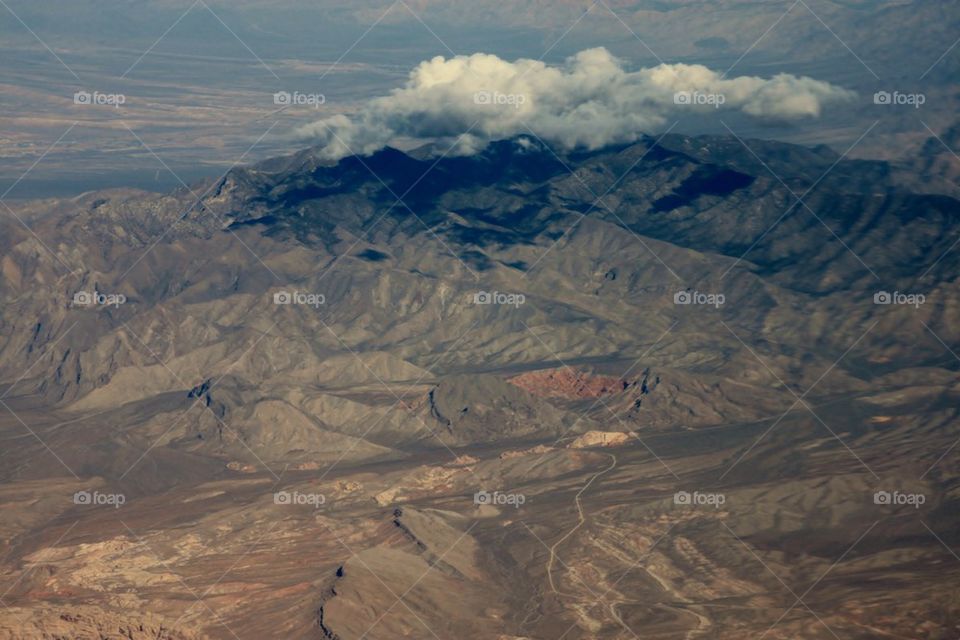 Clouds over the rocky mountain