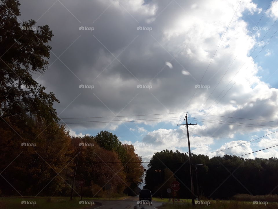 clouds n autumn trees