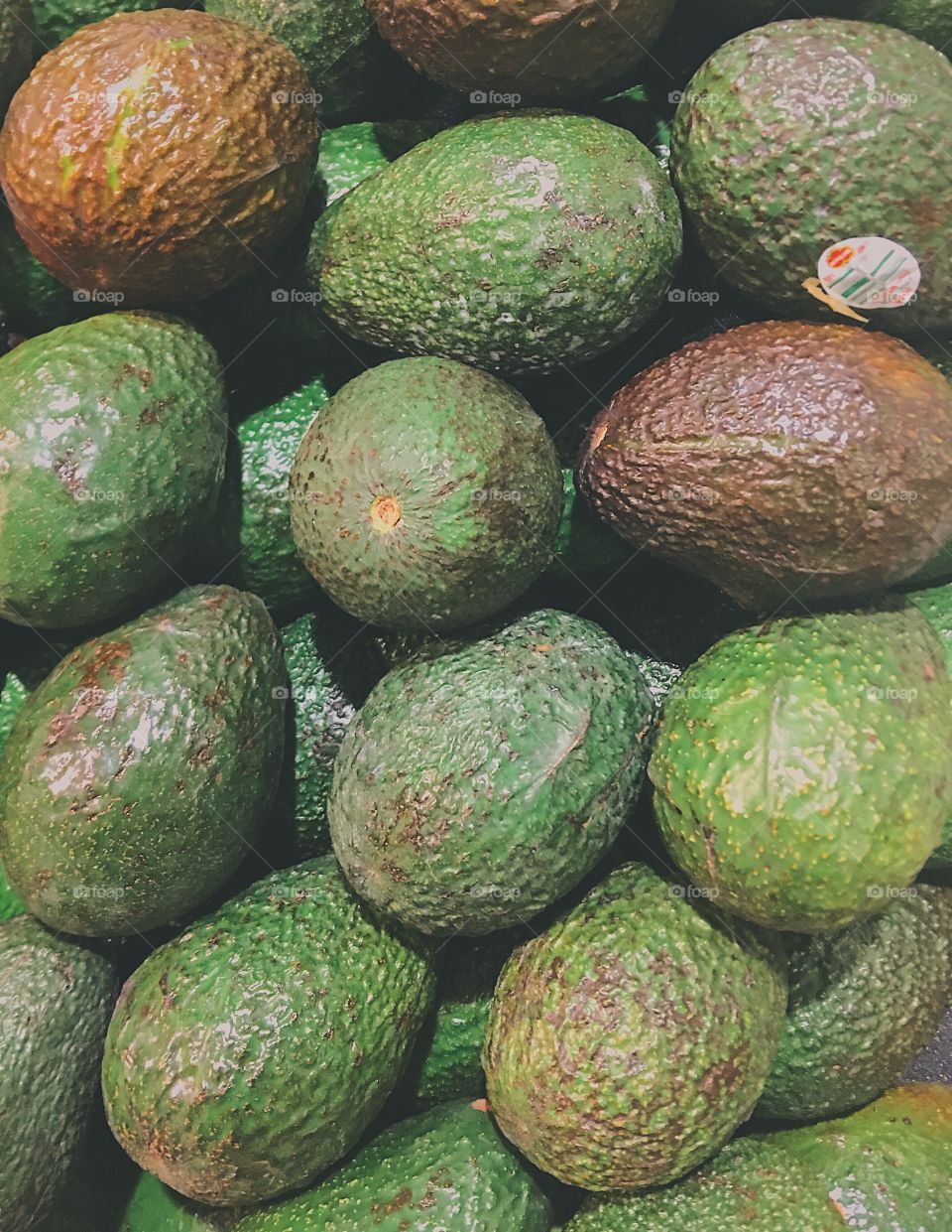 Avocados in the supermarket waiting to be purchased. 