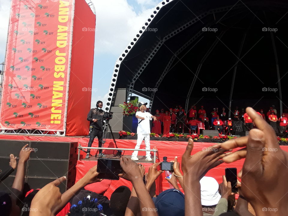 A singer performs at  the party's rally.