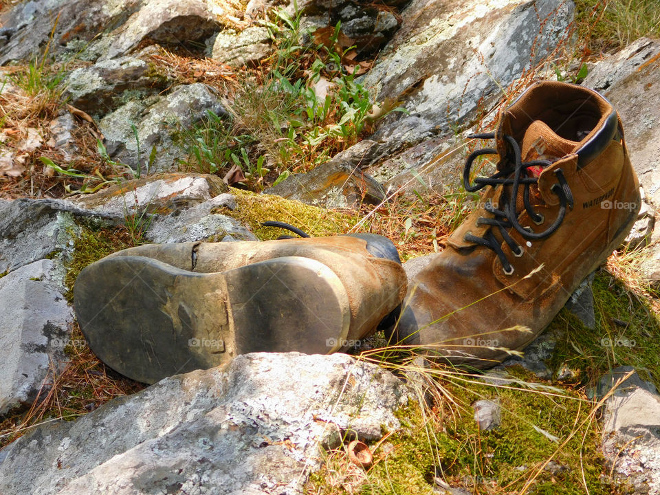 The boots were old. The leather had since cracked and aged. The toes were scuffed and they were falling apart at the seams. The boots had long lived their life of travel,work,joy, and love. After their final journey, it was time to throw them away. It was hard to say GOODBYE!