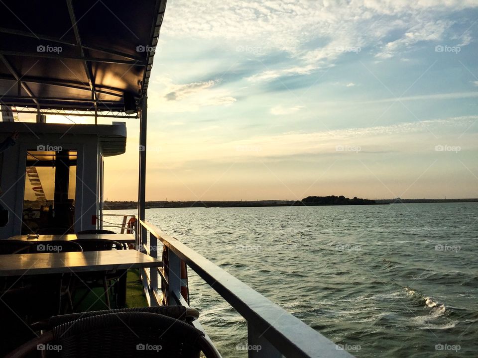 Boat on the water at sunset