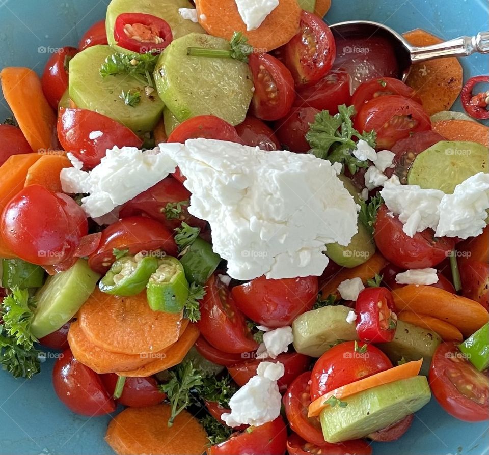 Summer time is here and so are the delicious fresh tomatoes, cucumber, pepper, parsley and feta cheese salads