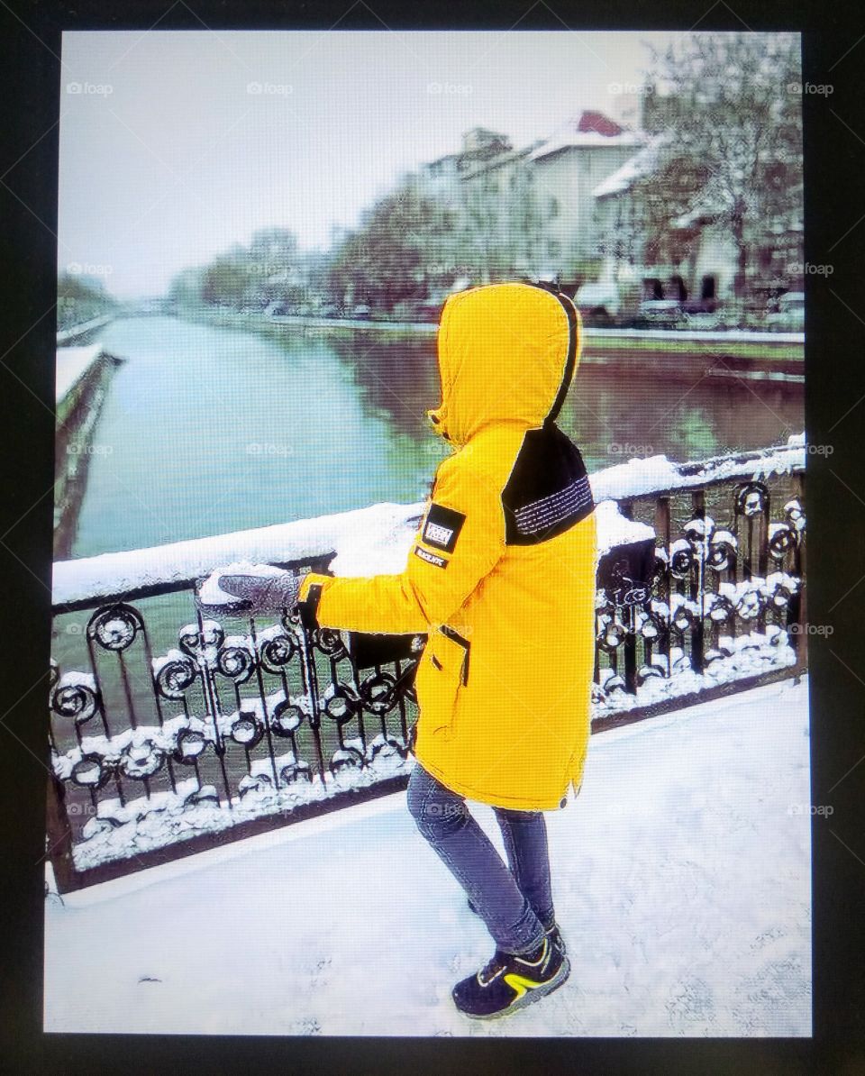 Boy in a yellow jacket