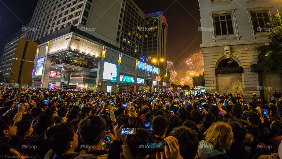New Year's Eve in Hong Kong. See how everyone is looking at their phone instead of the fireworks. 