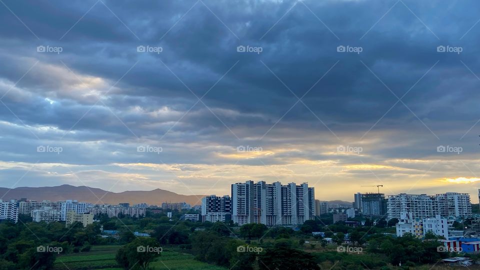 The sunset glow on the mountains. The golden hour on a cloudy day. 