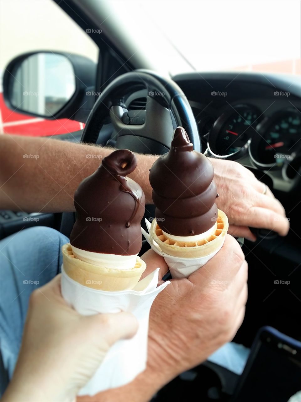 Hands Holding Ice Cream