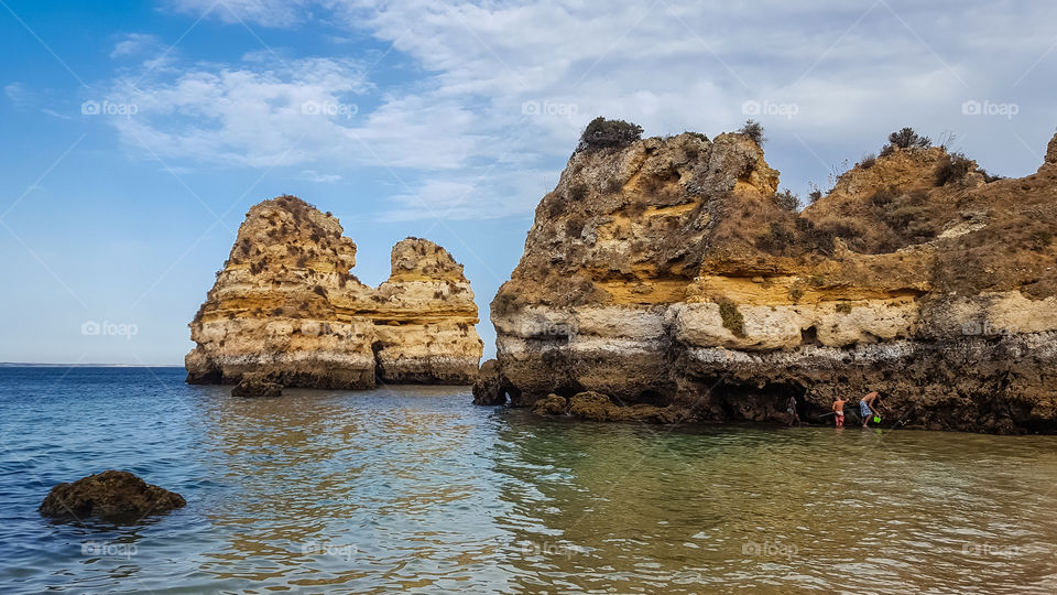 Looking for crabs at Praia do Camilo, Algarve, Portugal