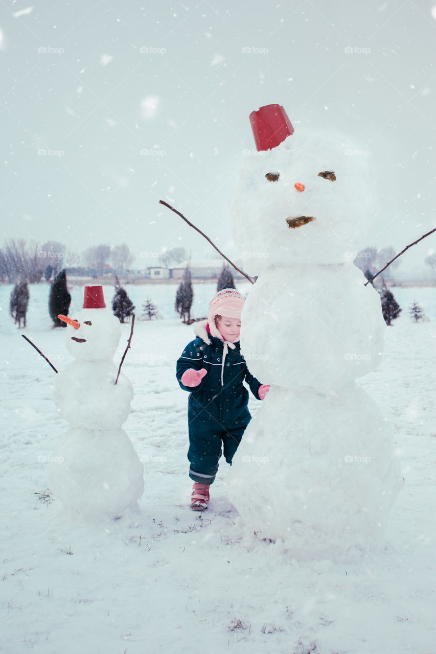 Winter with friends. Spending wintertime outdoors playing with snow