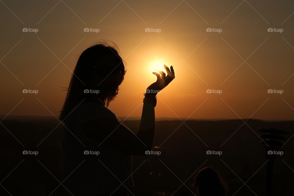 Beautiful sunset with girl silhouette 