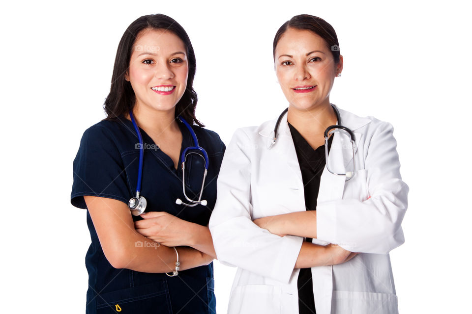 Doctor and nurse team standing together with arms crossed
