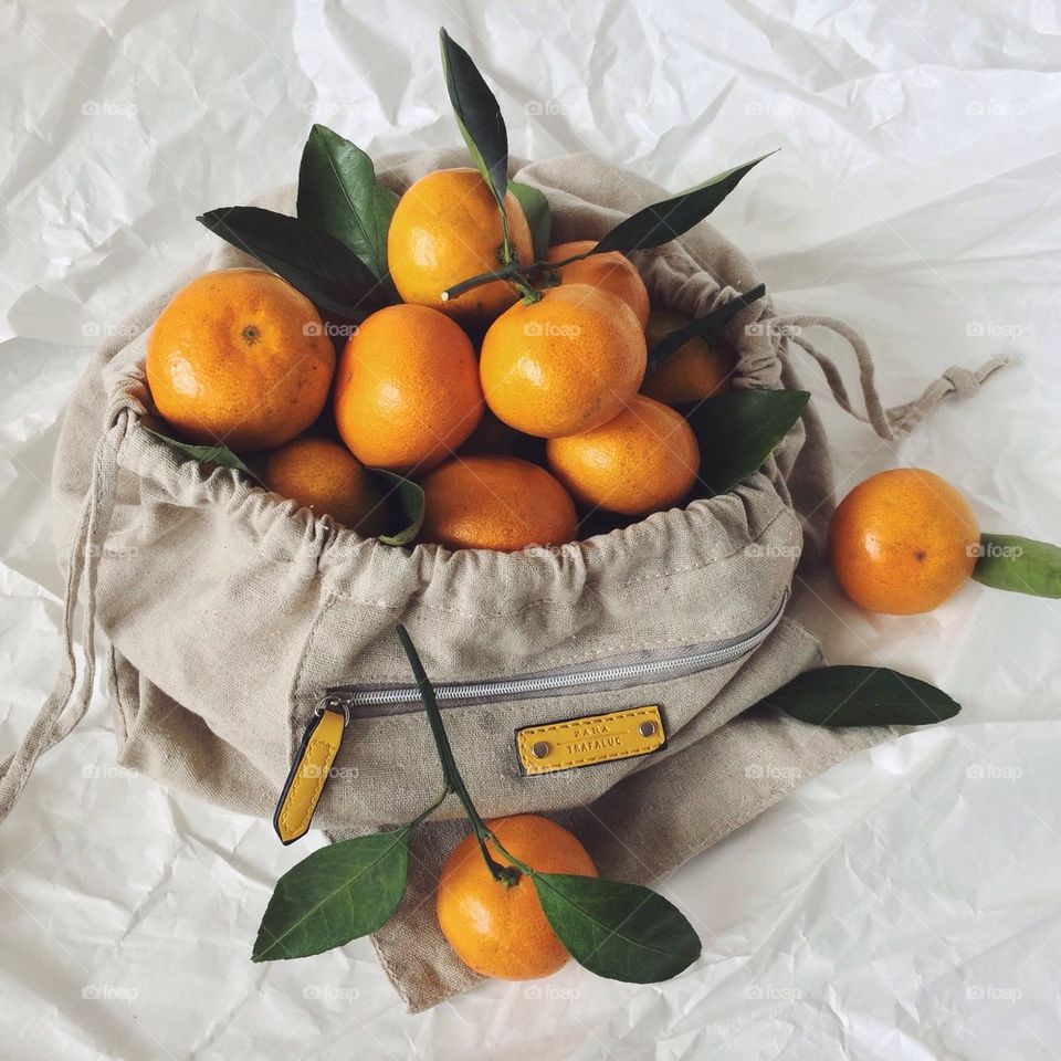 Fresh juicy oranges in bag