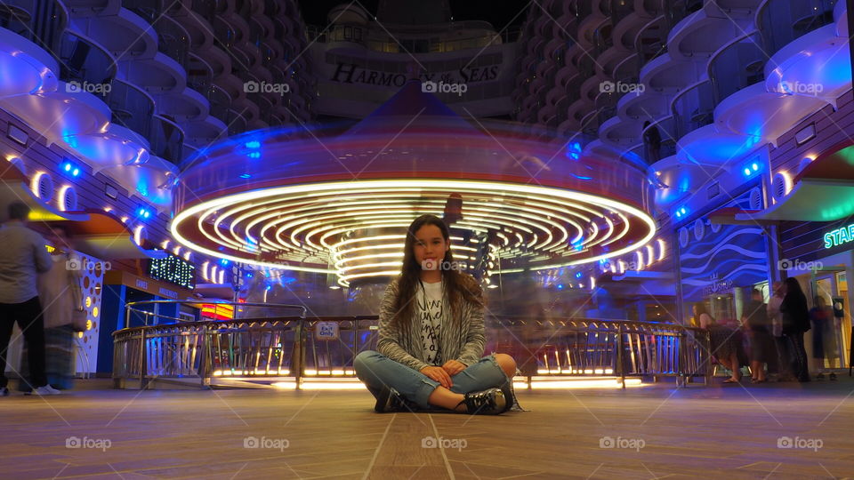 Girl and merry go round carousel 