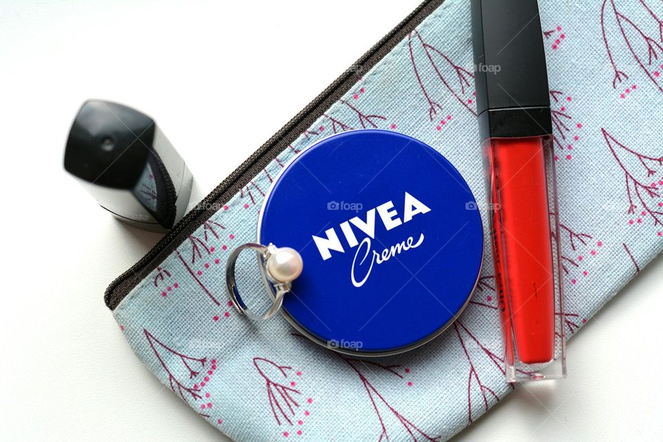 Nivea cream with beauty woman accessories top view