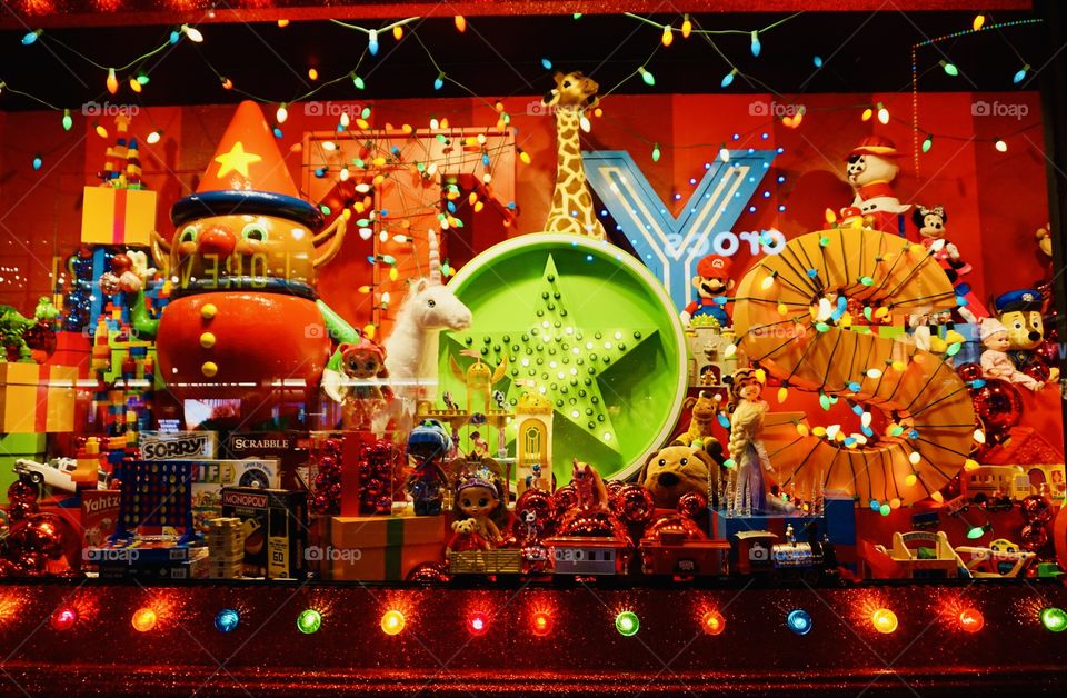 Christmas- Iconic Department store vibrant and whimsical Christmas display. A kaleidoscope of vibrant colors and whimsical characters.