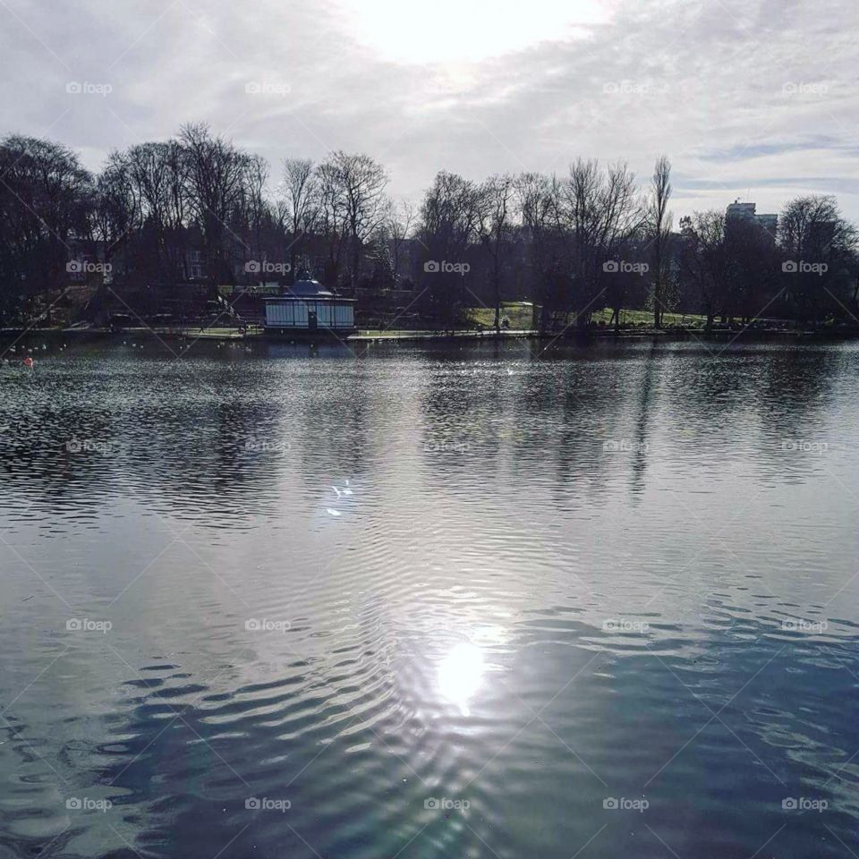Walsall arboretum , a view over the lake towards the bandstand
