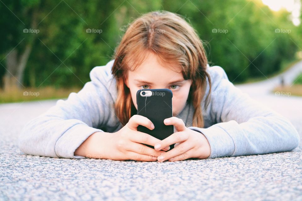 Girl taking photos with her phone