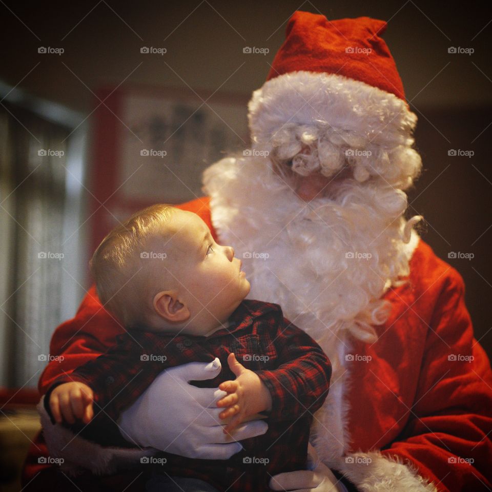 Portrait of santa and cute baby