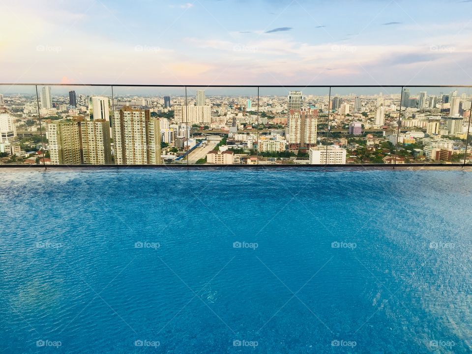 Swimming pool roof top with city view in bangkok