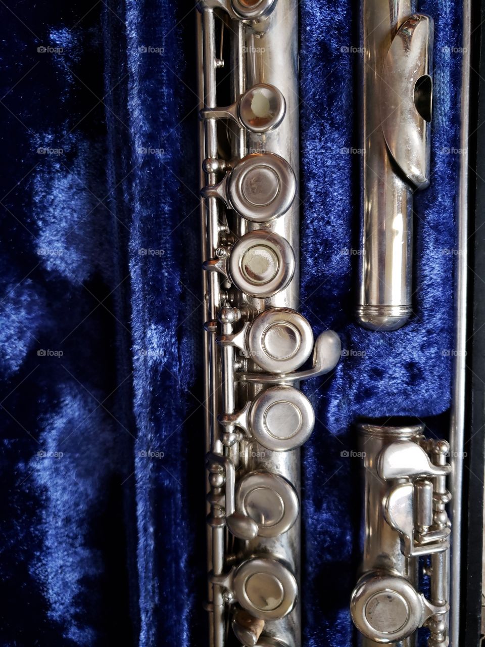 Close up well-loved flute in case