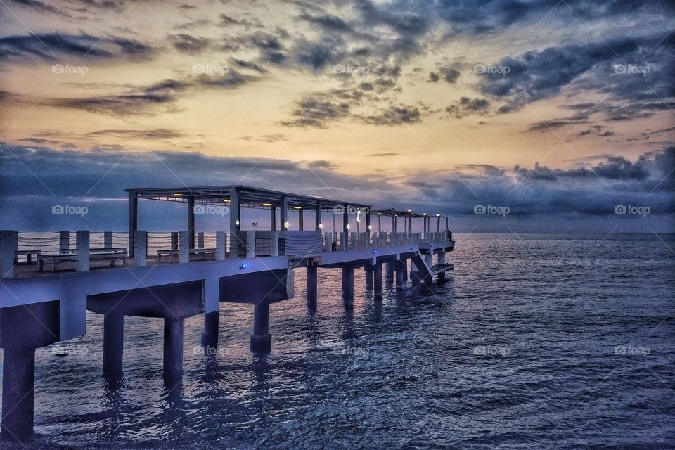 Sunset on the beach with beautiful sky. Beautiful seaside bridge at sunset. seaside bridge. Batumi Georgia